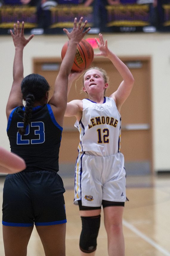 Lemoore's Jayda Brown, No. 12, takes a shot in Tuesday's Div. III playoff win over Morro Bay in the LHS Event Center.